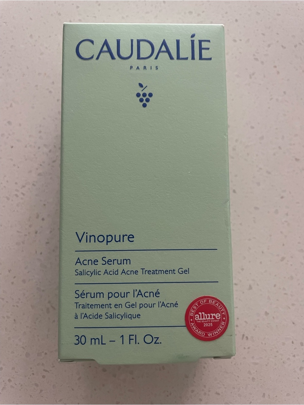 Caudalie Vinopure Acne Serum - Light Mint Green and Blue Text